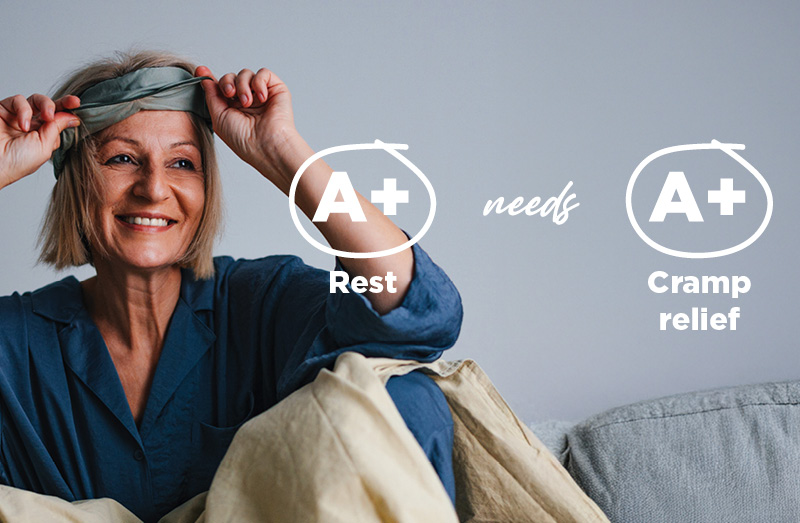 Person sitting on a bed wearing a blue sleepwear set and adjusting a sleep mask, with text overlay reading “A+ Rest needs A+ Cramp relief.